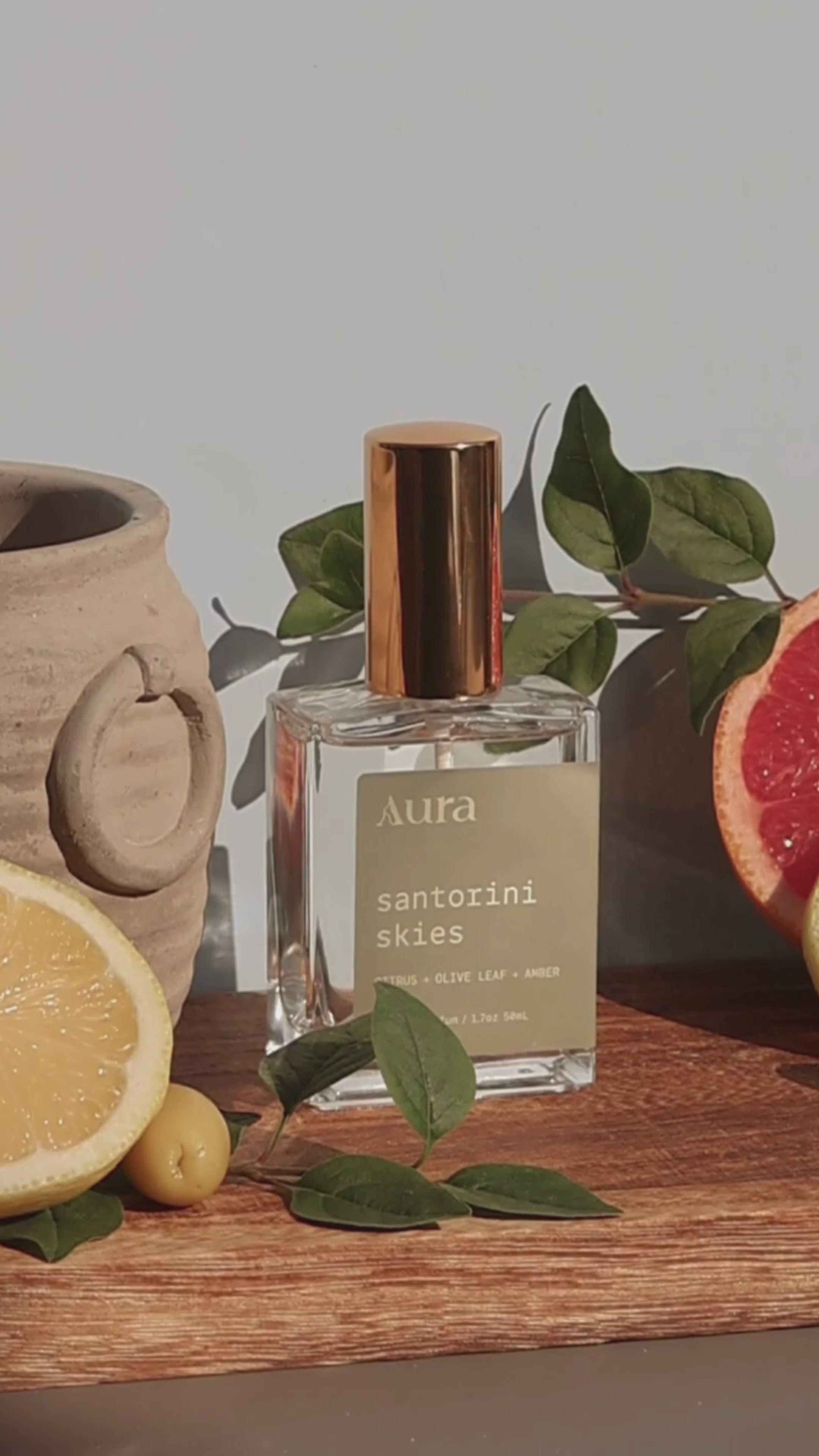Load video: santorini skies | citrus + olive leaf + amber