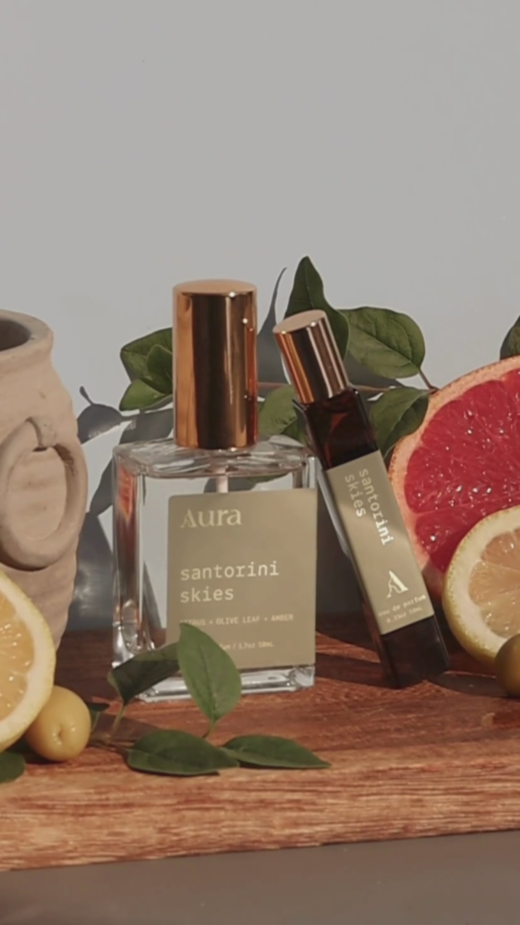 Load video: santorini skies | citrus + olive leaf + amber